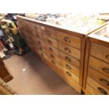 1940's Oak glazed haberdashery cabinet with a bank of 25 drawers.