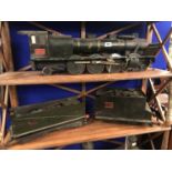 Early 20th. C. metal model train engine with three goods boxes.