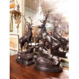 Pair of Bronze stags mounted on marble bases.