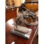 Model of a Cowboy rodeo bronze on marble base.