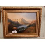 Gilt framed oil on canvas Lake and Mountain scene.