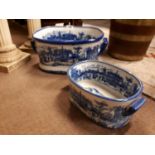 Two ceramic blue and white footbaths.