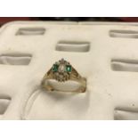 Early 20th C. gold ring with inset Emeralds and pearls.