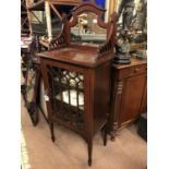 Edwardian inlaid mahogany display cabinet witj mirrored back.