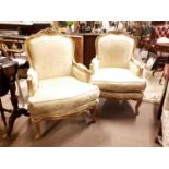 Pair of early 20th.C. gilt upholstered armchairs in the french manner.