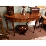 Pair of inlaid rosewood and mahogany demi-lune side tables, inlay depictingladies heads and foliage.