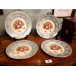 Set of four Aynsley fine bone china plates with hand painted centre panel and gilded decoration.