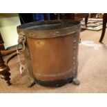 Victorian brass and copper log bucket with lion mask handle and paw feet.