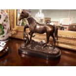 Bronze model of Mare and foal on marble base.