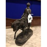 Bronze model of a horse and jockey.