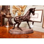 Decorative bronze model of a prancing horse.