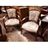 Pair of late 19th C. mahogany open arm armchairs with embriodered seats.