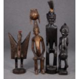 Quattro sculture tribali in legno scolpito. Africa. Mis. Alt. massima cm. 85 ca.