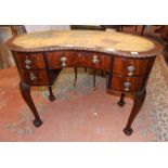 MAHOGANY KIDNEY SHAPED WRITING DESK WITH GADROONED EDGE,