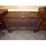 17TH CENTURY OAK THREE PANEL COFFER WITH CARVED STRAPWORK AND FRUITING VINE MOTIFS 73CM H X 123CM W