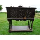 19TH CENTURY JACOBEAN REVIVAL CARVED OAK LIVERY CUPBOARD WITH GALLERY BACK CARVED PANEL DOORS ON