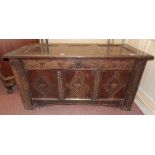 17TH CENTURY OAK JOINED PANEL COFFER WITH CARVED LUNETTE FRIEZE AND LOZENGE FRONT PANELS 120CM W X