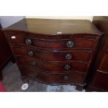 GEORGE III STYLE MAHOGANY SERPENTINE CHEST OF FOUR GRADUATED DRAWERS WITH CANTED SIDES ON OGEE