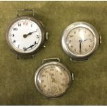 THREE EARLY 20TH CENTURY SILVER AND BASE METAL WATCHES