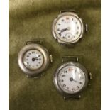 THREE EARLY 20TH CENTURY SILVER AND BASE METAL WATCHES