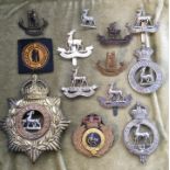 BOX CONTAINING THE ROYAL WARWICKSHIRE REGIMENT BADGES AND INSIGNIA