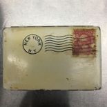 INTERESTING POWDER COMPACT IN THE FORM OF A UNITED STATES FRANKED AND STAMPED ENVELOPE,