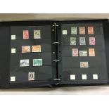 ALBUM OF GB AND COMMON WEATLTH POSTAGE STAMPS INCLUDING GOLD COAST, LEEWARD ISLANDS, NEW HEBRIDIES,