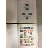 TWO ALBUMS OF UNITED STATES OF AMERICA POSTAGE STAMPS AND TWO LOOSE PAGES OF SIMILAR STAMPS