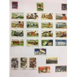 THREE POSTAGE STAMPS ALBUMS - AUSTRALIA, THE CARRIBEAN ISLANDS,