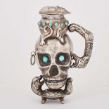 Indonesian Turquoise Inset Silver Skull Form Jug, early 20th century, height 7.3 in — 18.5 cm