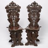 Pair of Victorian Renaissance Style Carved Walnut Hall Chairs, late 19th century, 50 x 19 x 20 in —