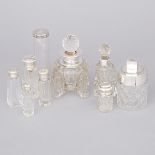 Nine Mainly English Silver Mounted Cut Glass Dressing Table Bottles, 20th century, largest height 5.