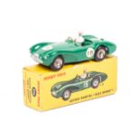 A French Dinky Toys Aston Martin (506). Example in dark green with spun plated wheels, RN15.