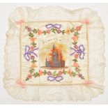 A WWI silk cushion cover “Souvenir d’Ypres”, colour printed centre picture of Ypres in embroidered