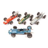 4 large scale Schuco clockwork tinplate Formula One/Two cars. A Lotus (1071) in green with yellow