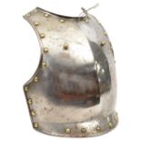 A 19th century continental heavy steel breastplate, the edges with large domed brass studs, and with