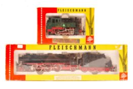 2 Fleischmann HO locomotives. A 4-6-2 class 01 steam tender locomotive 01 220 in black and red