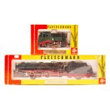 2 Fleischmann HO locomotives. A 4-6-2 class 01 steam tender locomotive 01 220 in black and red