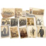 14 WWI monochrome postcards of individuals, mostly infantry men in service dress; 4 of family groups