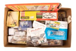 A quantity of HO gauge trackside figures and accessories by Preiser, Faller, etc. Including; Boxed
