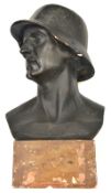 A large black painted plaster bust of a German soldier, this lot has been withdrawn