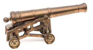 A good 19th century model cannon, the bronze barrel 10½”, on its 4 wheeled openwork brass garrison