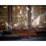 An impressively large wooden plank on frame model of HMS Victory. Three masted and with standing and