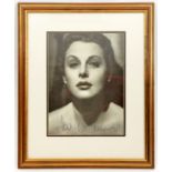 A close up head and shoulders studio photographic portrait signed “Hedi Lemaar”, well mounted and