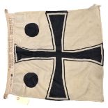 A small Imperial German naval flag denoting the rank of Rear Admiral, black on white cross with a