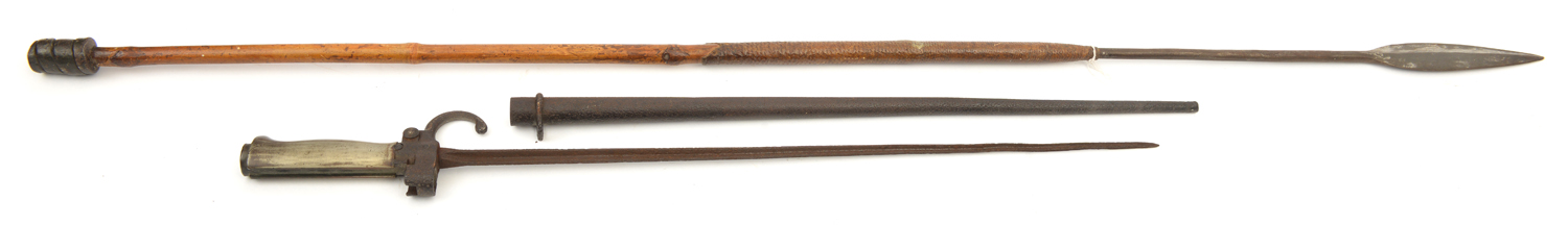 An African stabbing spear, leaf blade on long tang to bamboo haft with leather covered cord grips,