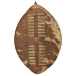 A small Zulu hide shield, 20” overall, with wooden pole and small loop handle. GC, appears to have