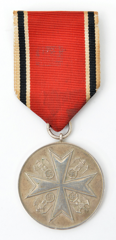 A silver Medal of Merit of the Order of the German Eagle, with ribbon and pin suspender. GC