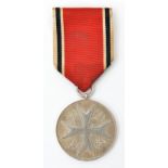 A silver Medal of Merit of the Order of the German Eagle, with ribbon and pin suspender. GC