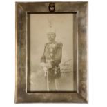 A rare signed ¾ length photographic portrait of King Peter I of Serbia, in full dress military